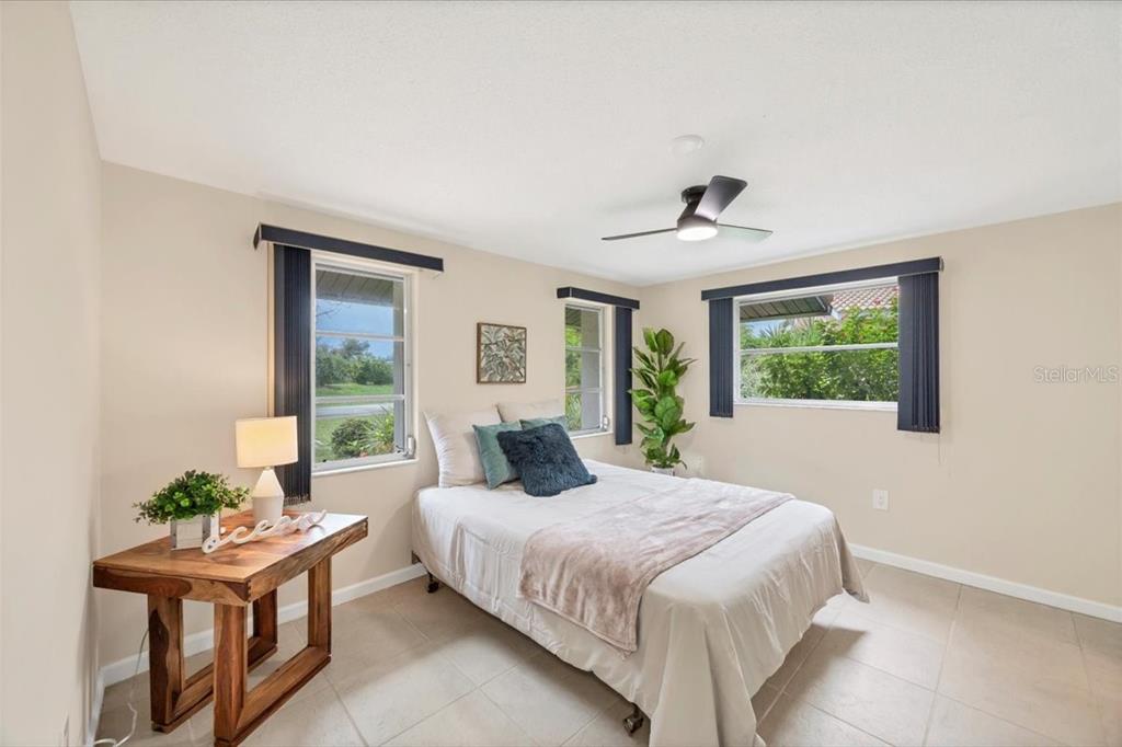 4696 Pompano Street Placida, FL 33946 - Photo 15 of 23 a bedroom with a bed and a window