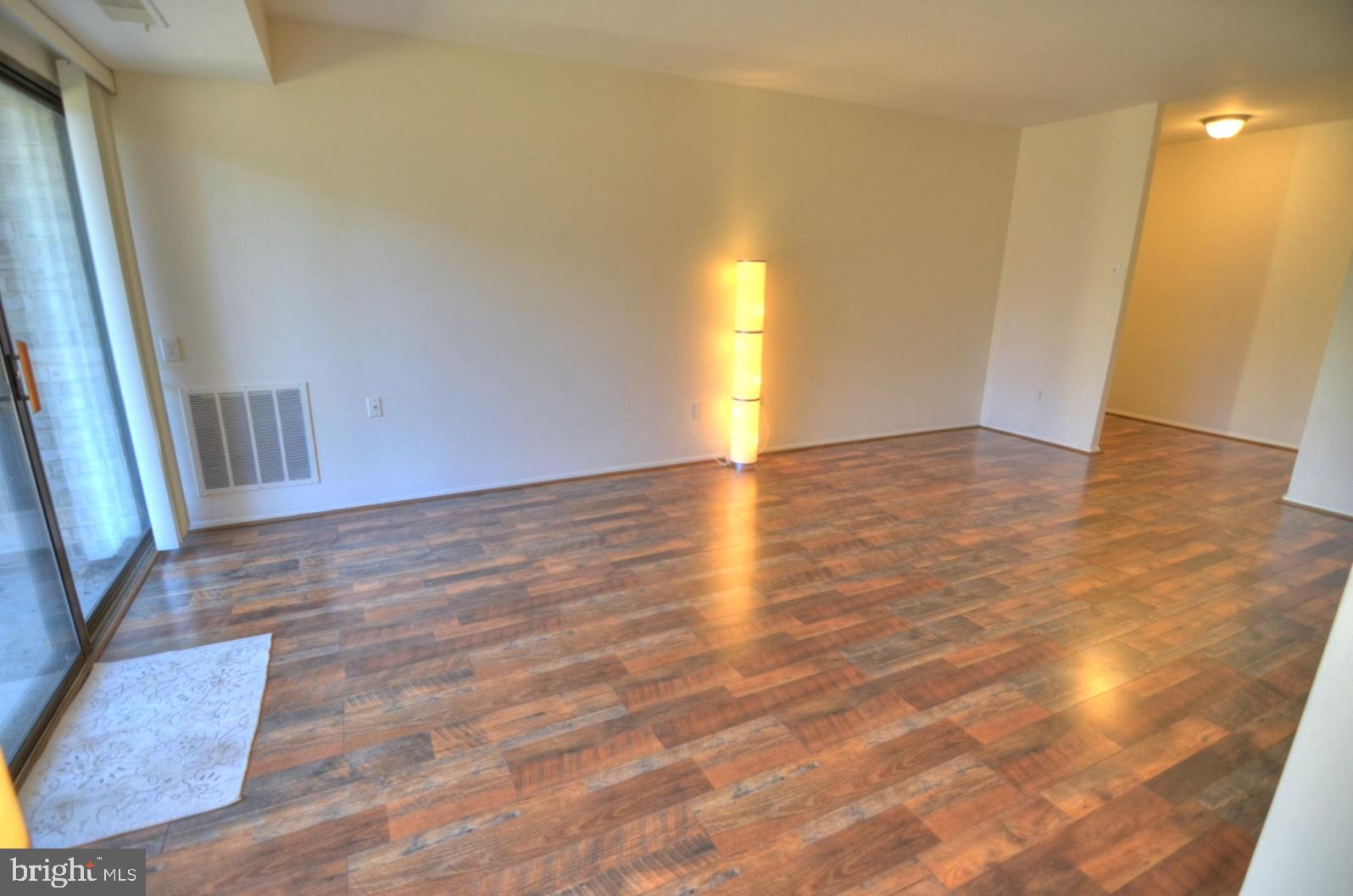 2072 Royal Fern Court, Unit 1B Reston, VA 20191 - Photo 14 of 37 View of living room from dining room
