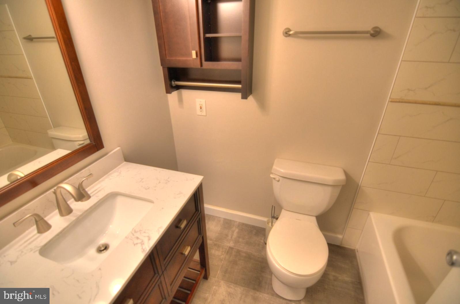 2072 Royal Fern Court, Unit 1B Reston, VA 20191 - Photo 20 of 37 Updated bath, ceramic tile, decorative cabinet