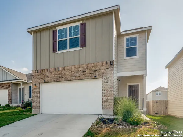 a front view of a house with garage