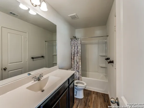 a bathroom with a sink toilet tub and shower