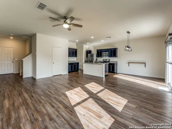 a view of kitchen with cabinets and wooden floor