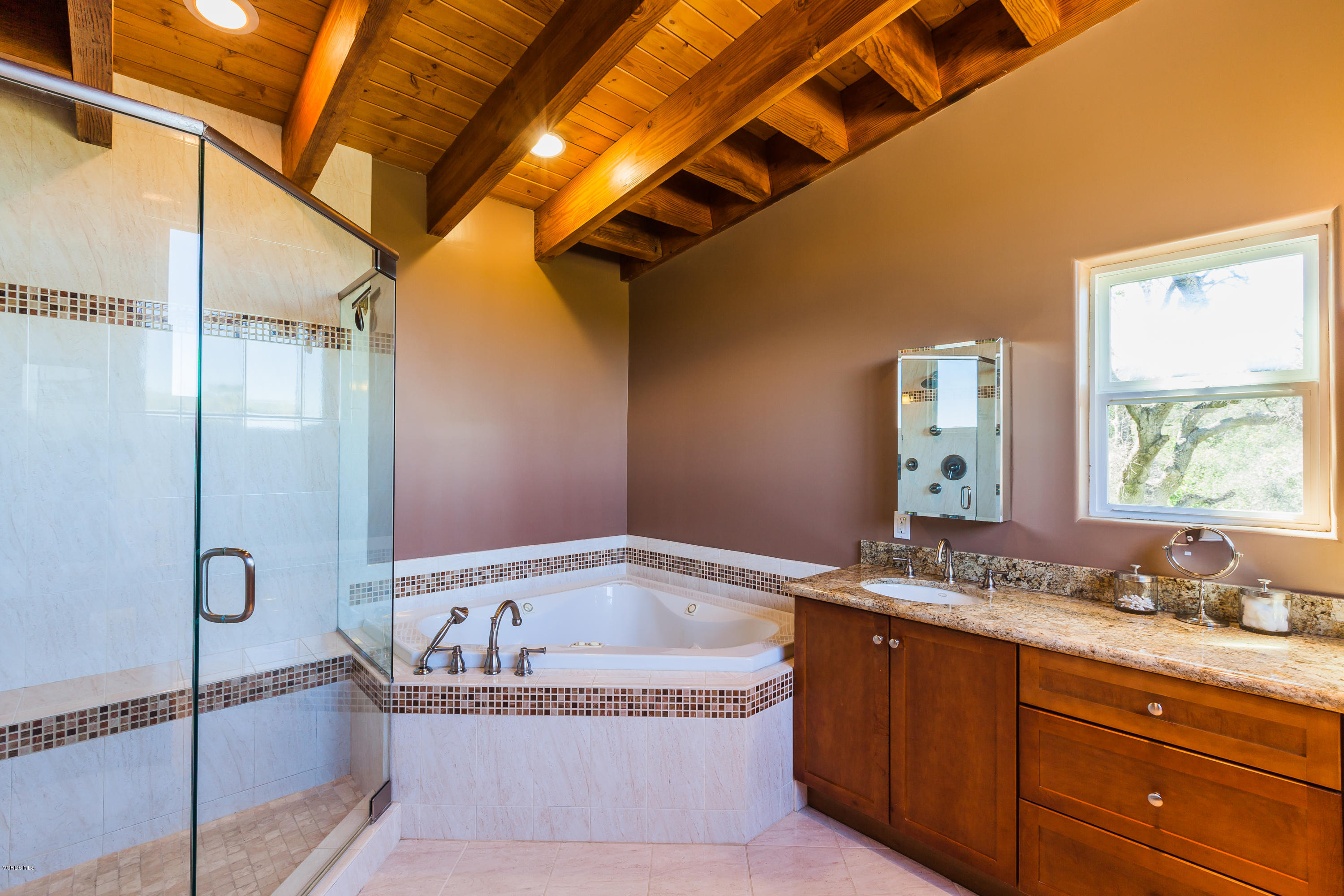 6304 Alta Vista Road Simi Valley, CA 93063 - Photo 16 of 20 a spacious bathroom with a granite countertop tub sink and mirror