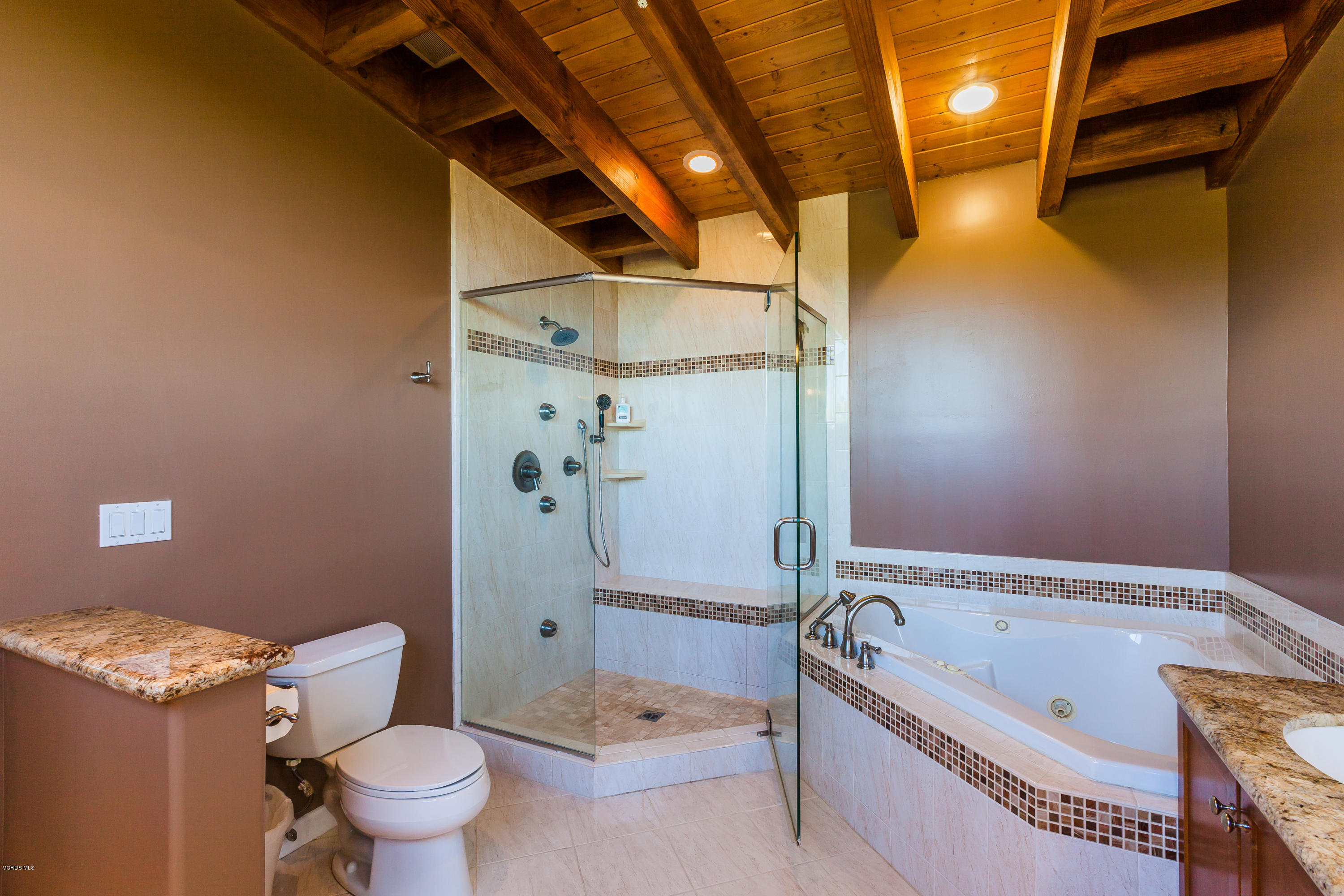 6304 Alta Vista Road Simi Valley, CA 93063 - Photo 17 of 20 a bathroom with a granite countertop toilet a sink and bathtub