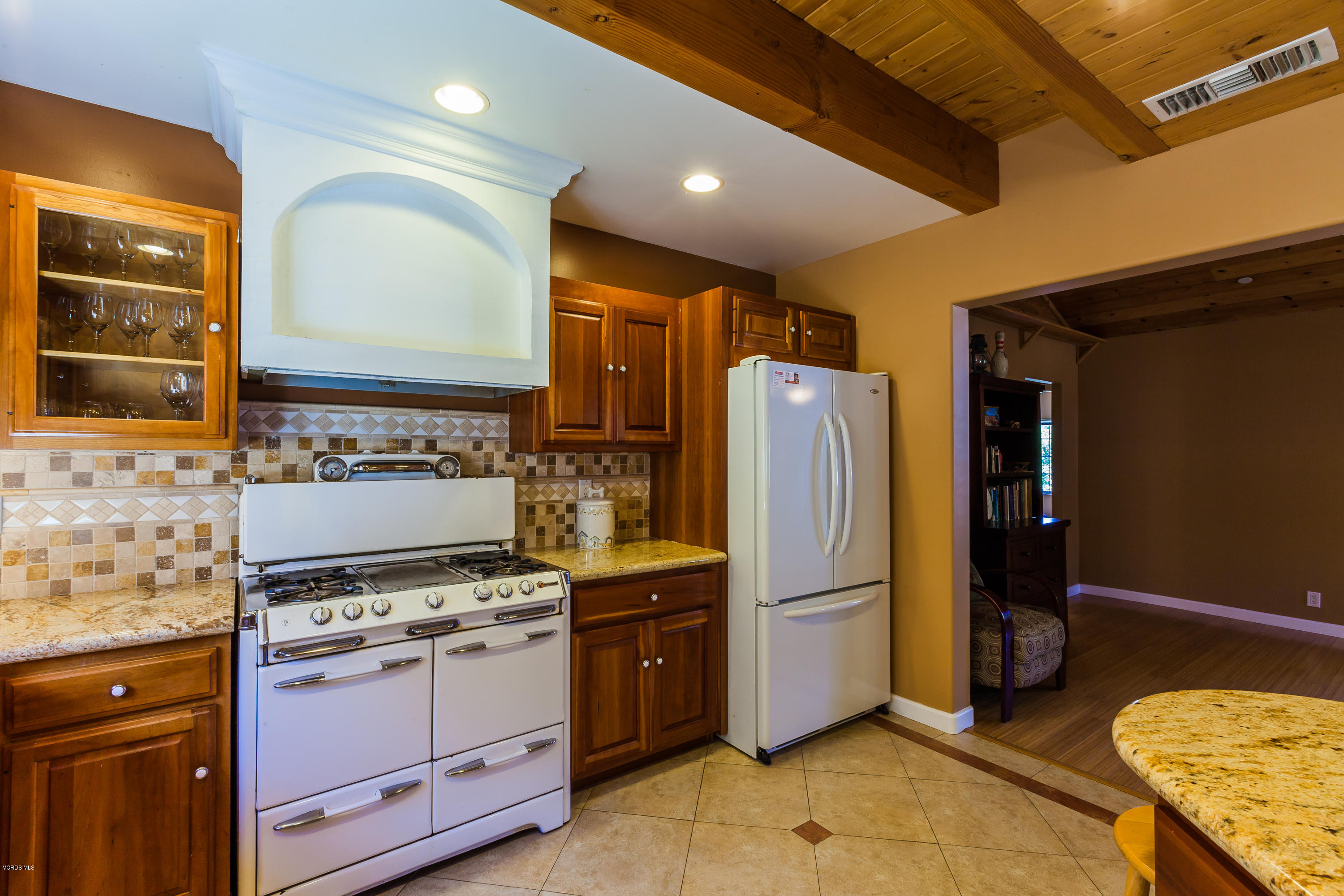 6304 Alta Vista Road Simi Valley, CA 93063 - Photo 4 of 20 a kitchen with stainless steel appliances granite countertop a refrigerator and a stove