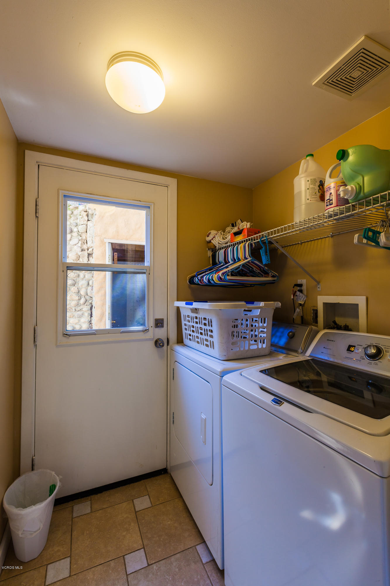 6304 Alta Vista Road Simi Valley, CA 93063 - Photo 10 of 20 a kitchen with a stove and a microwave