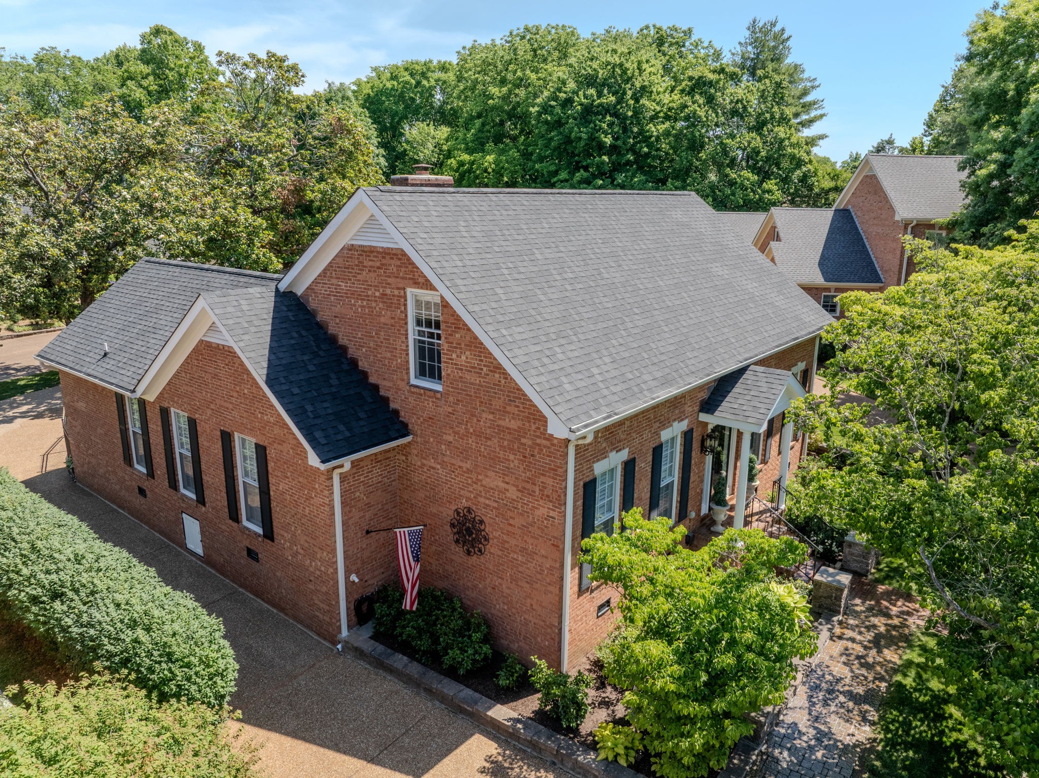 404 Chesterfield Place Franklin, TN 37064 - Photo 2 of 38 an aerial view of a house with yard and trees in the background