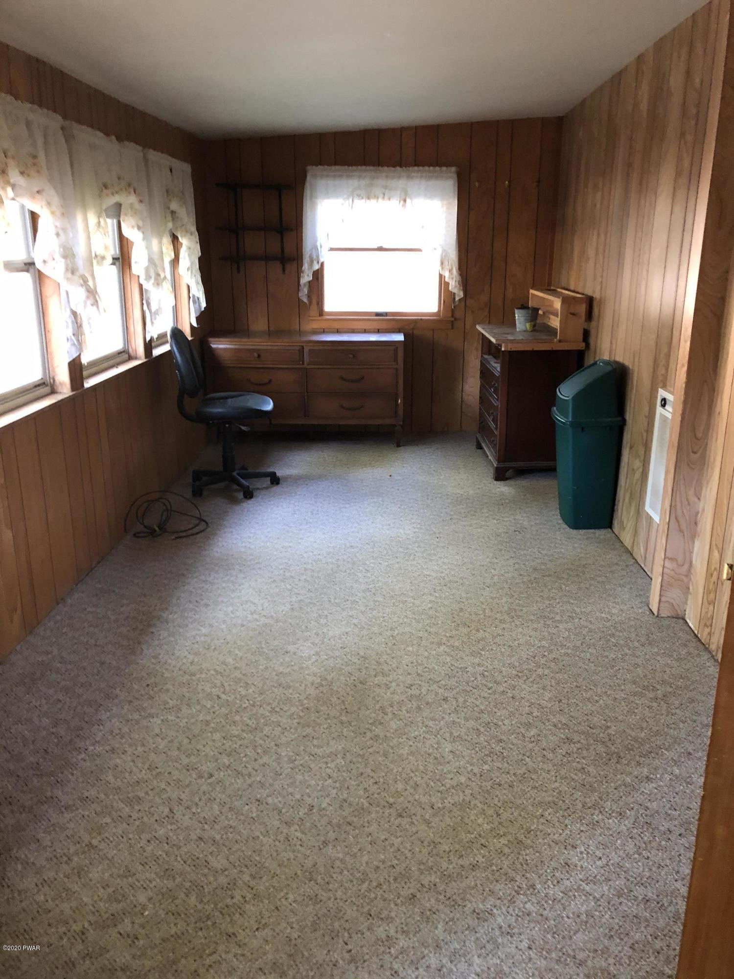 45 W Road Hawley, PA 18428 - Photo 12 of 19 a living room with furniture window and flat screen tv