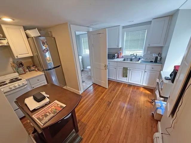 a bathroom with a shower and a toilet