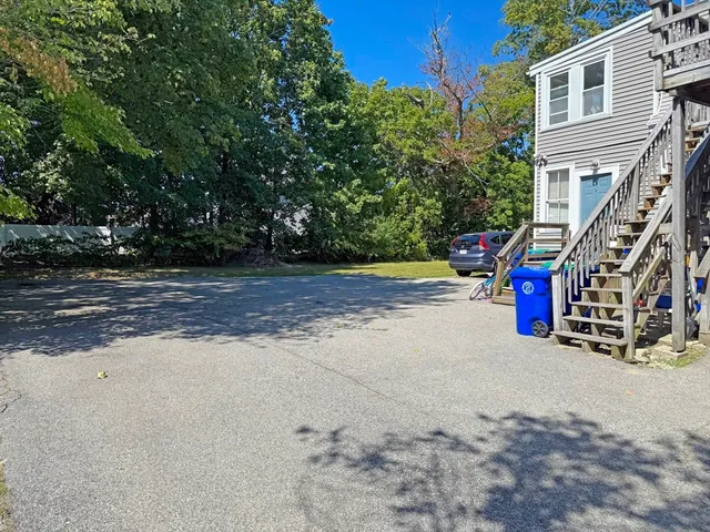 a view of car parked in front of a building