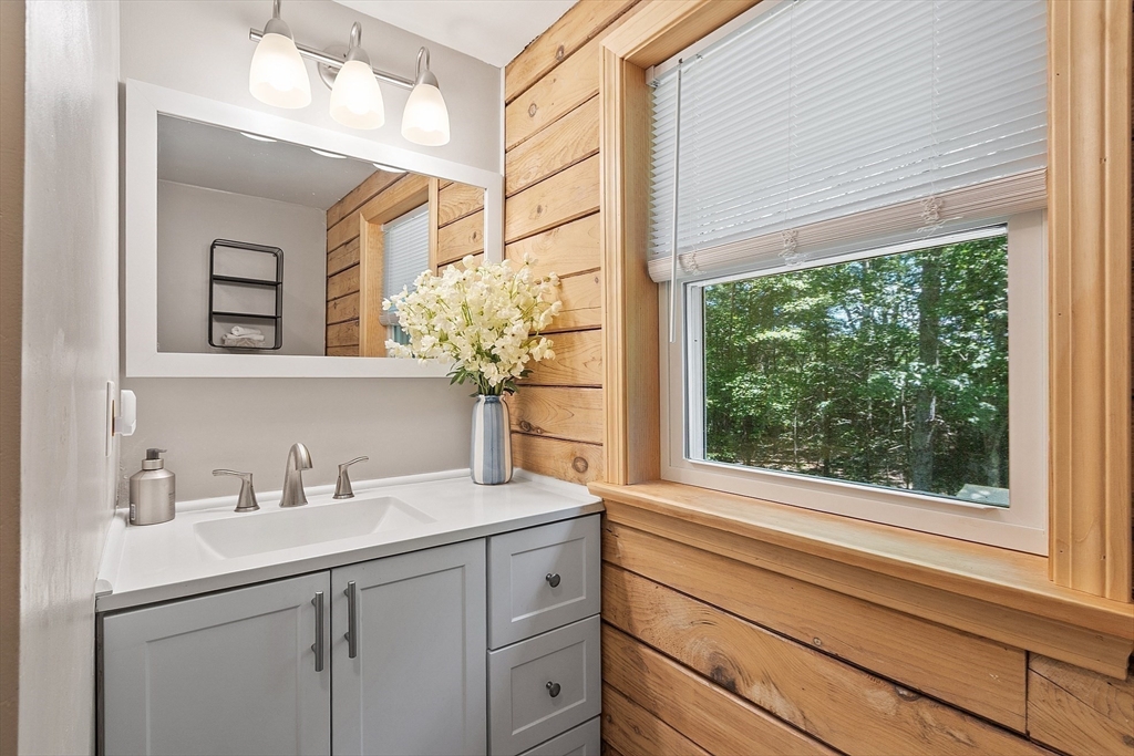 173 Minott Road Westminster, MA 01473 - Photo 18 of 33 a bathroom with a sink a mirror and next to a window