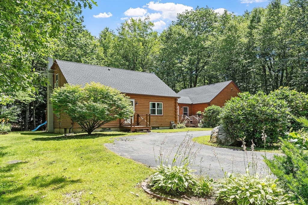 173 Minott Road Westminster, MA 01473 - Photo 23 of 33 a view of a house with a yard and potted plants