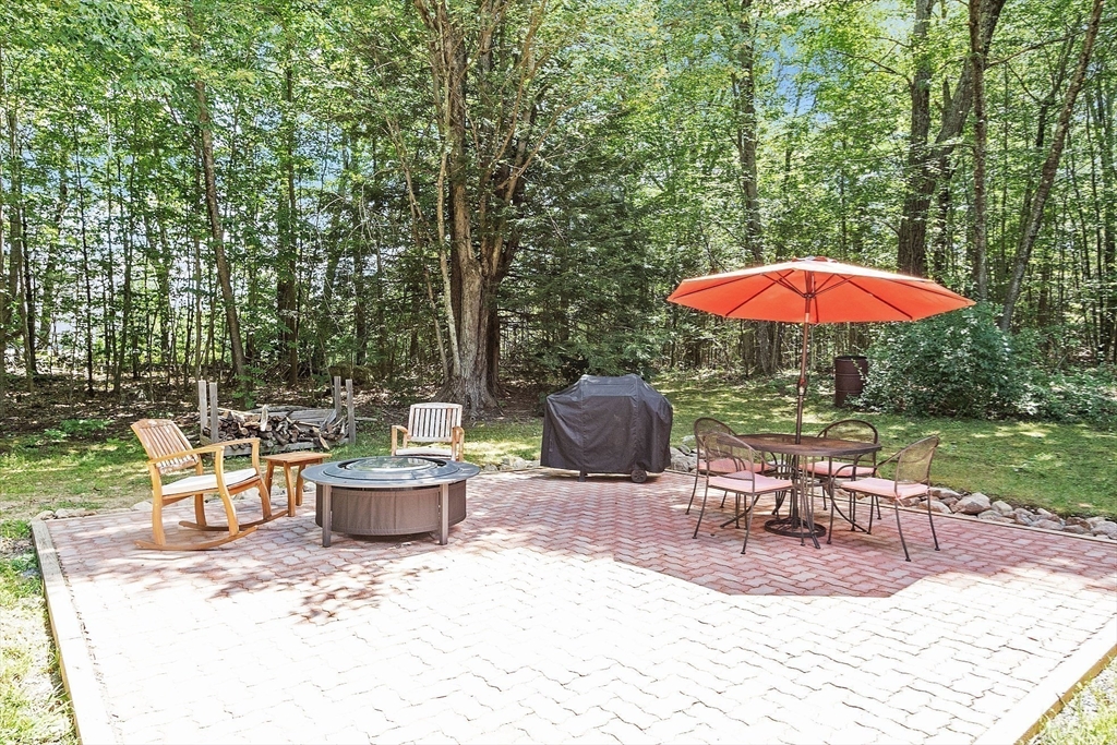 173 Minott Road Westminster, MA 01473 - Photo 27 of 33 an outdoor space with furniture and umbrella
