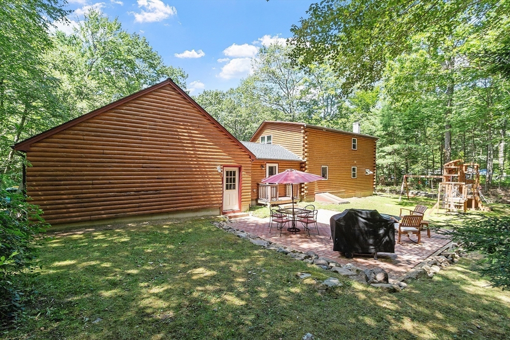 173 Minott Road Westminster, MA 01473 - Photo 28 of 33 a backyard of a house with table and chairs