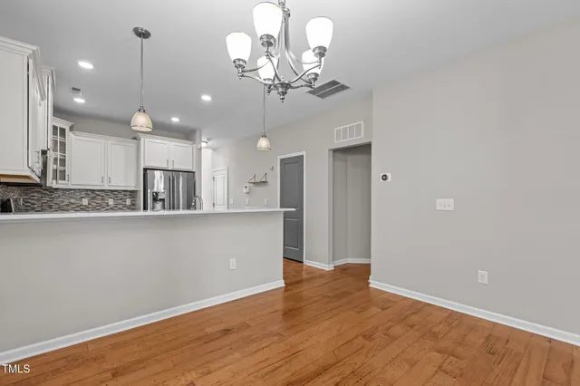 a view of a kitchen with marble kitchen and stainless steel appliances