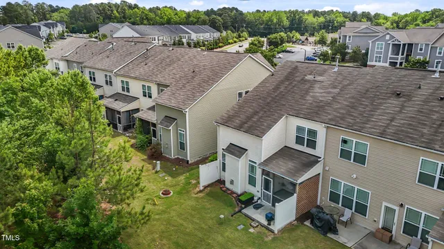 a aerial view of a house with a yard