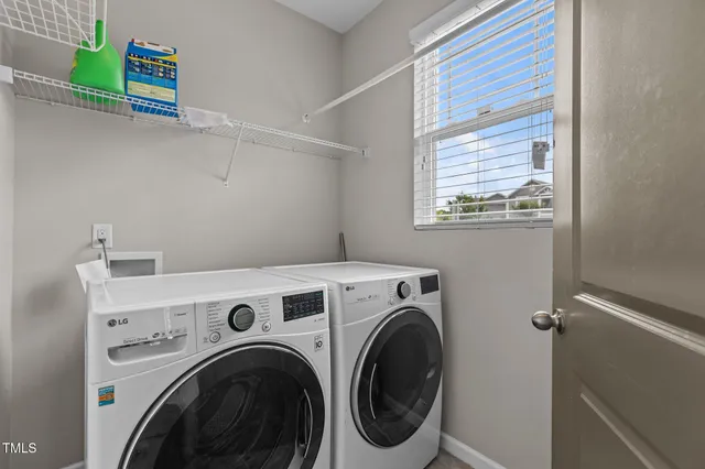 a utility room with dryer and washer