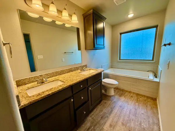 a bathroom with a bath tub and a shower