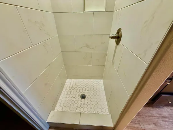 a bathroom with a sink a vanity and a mirror