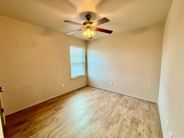a view of a chandelier fan and closet