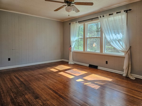 265 Tyler Road Ellijay, GA 30540 - Photo 16 of 43 a view of an empty room with a window and wooden floor
