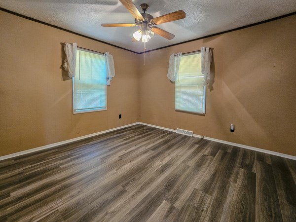 265 Tyler Road Ellijay, GA 30540 - Photo 2 of 43 an empty room with windows and fan