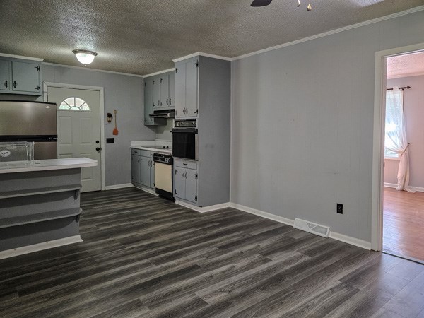 265 Tyler Road Ellijay, GA 30540 - Photo 22 of 43 a kitchen with a refrigerator and a stove top oven