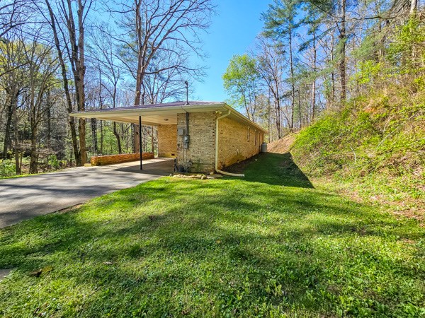 265 Tyler Road Ellijay, GA 30540 - Photo 31 of 43 a backyard of a house with lots of green space