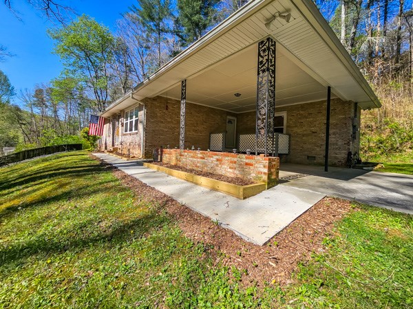 265 Tyler Road Ellijay, GA 30540 - Photo 40 of 43 a view of a house with a yard and wooden fence