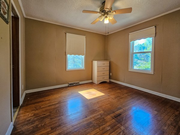 265 Tyler Road Ellijay, GA 30540 - Photo 6 of 43 a view of an empty room with window and wooden floor