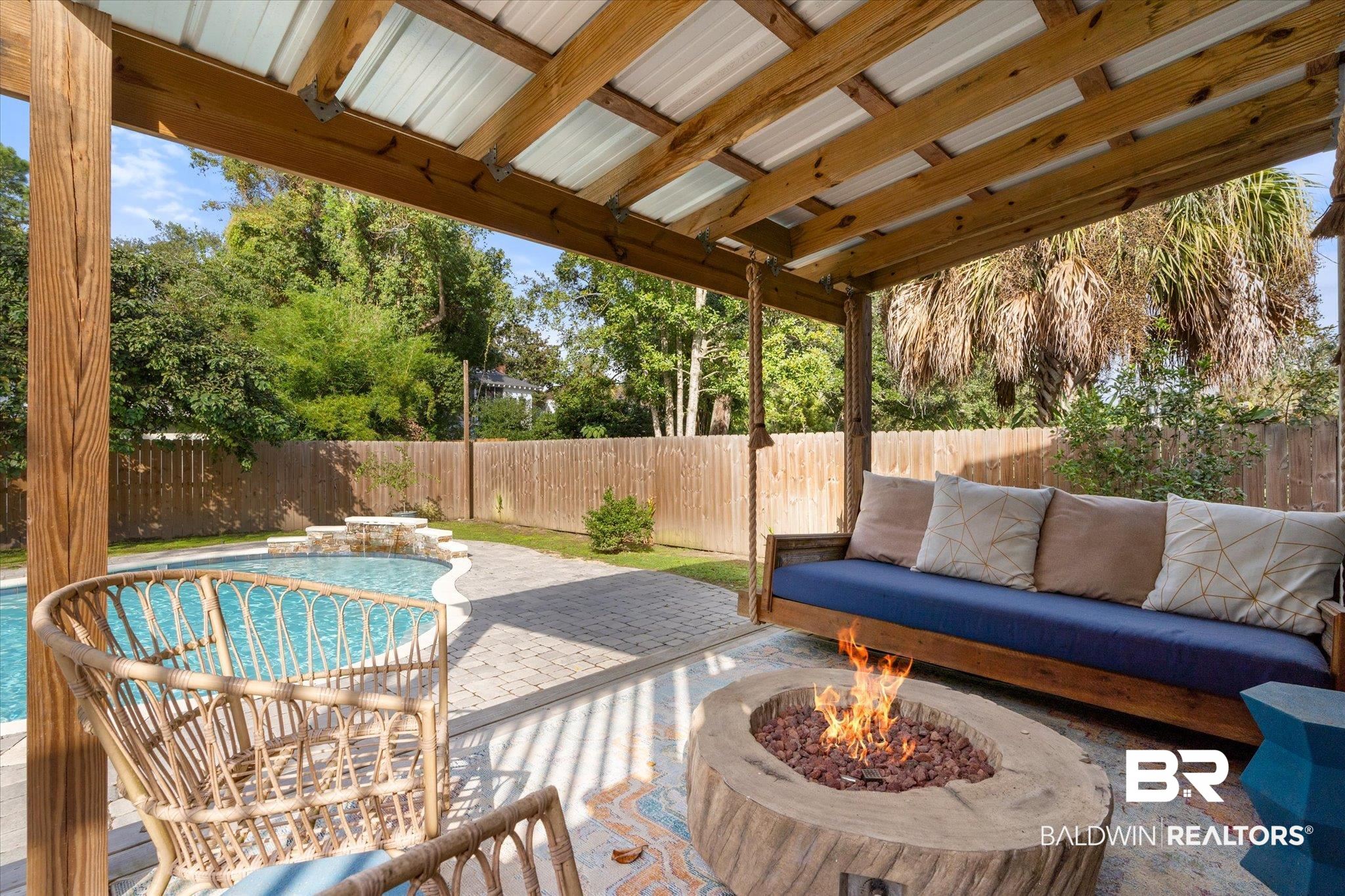 1210 Government Street Mobile, AL 36604 - Photo 25 of 37 View of patio with a fenced in pool and a fire pit