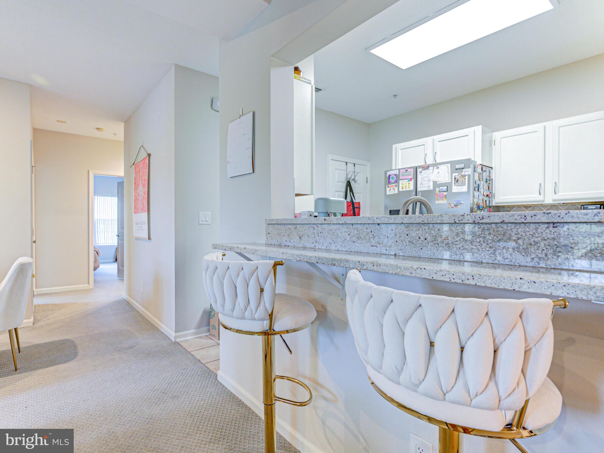 1720 Lake Shore Crest Drive, Unit 35 Reston, VA 20190 - Photo 12 of 41 a kitchen with stainless steel appliances granite countertop a sink and cabinets