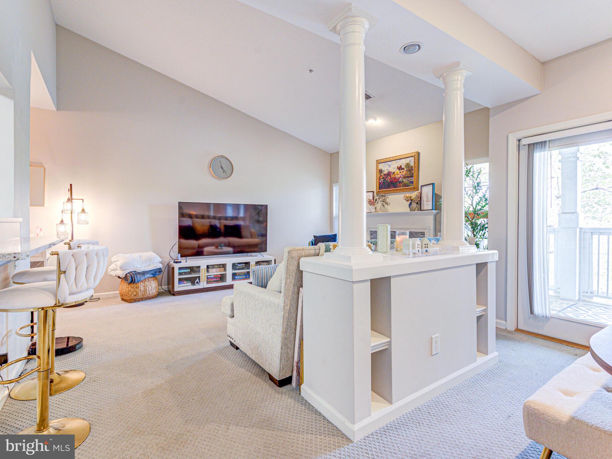 1720 Lake Shore Crest Drive, Unit 35 Reston, VA 20190 - Photo 14 of 41 a view of living room with furniture and flat screen tv