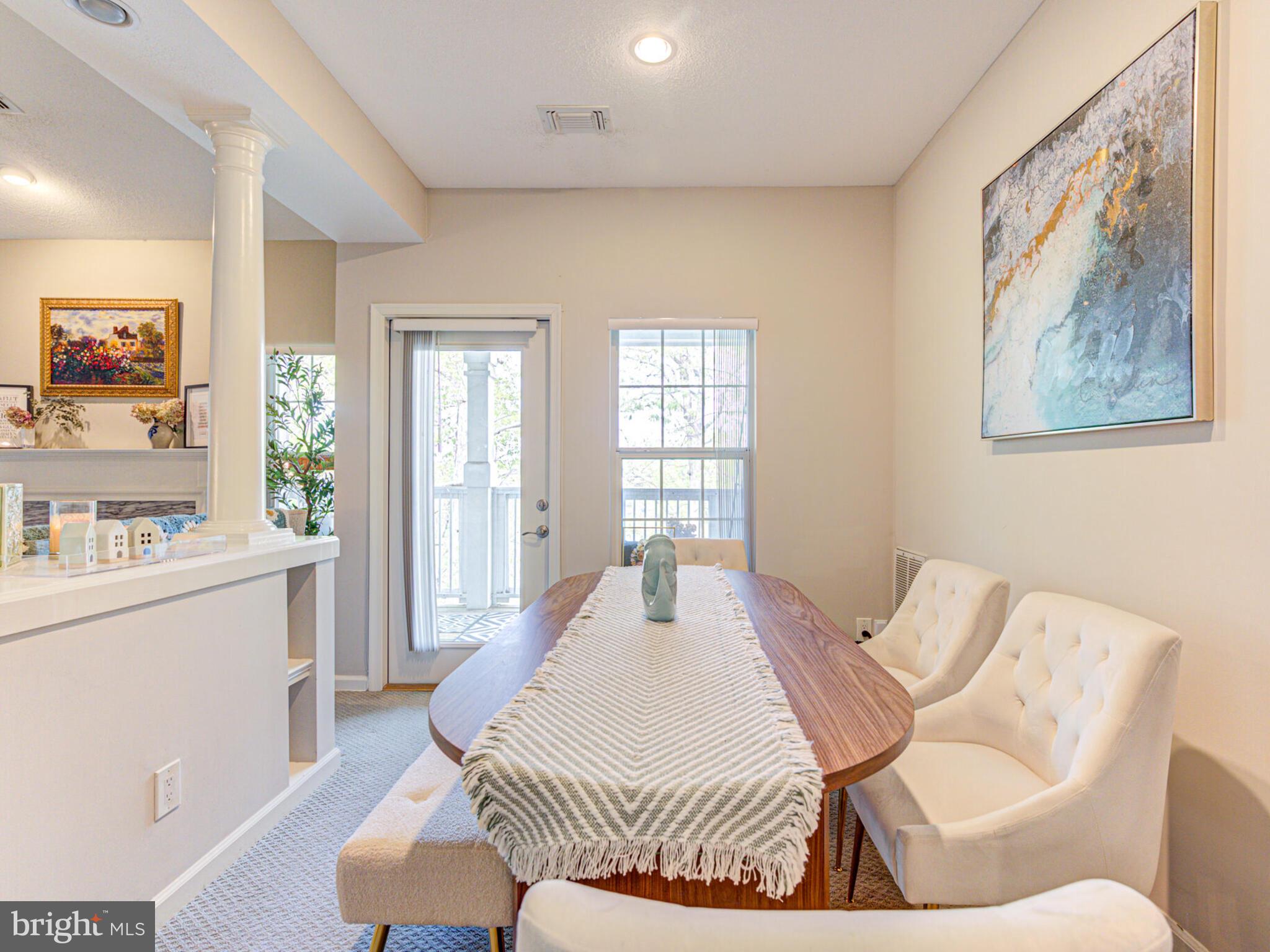1720 Lake Shore Crest Drive, Unit 35 Reston, VA 20190 - Photo 15 of 41 a living room with furniture and a table