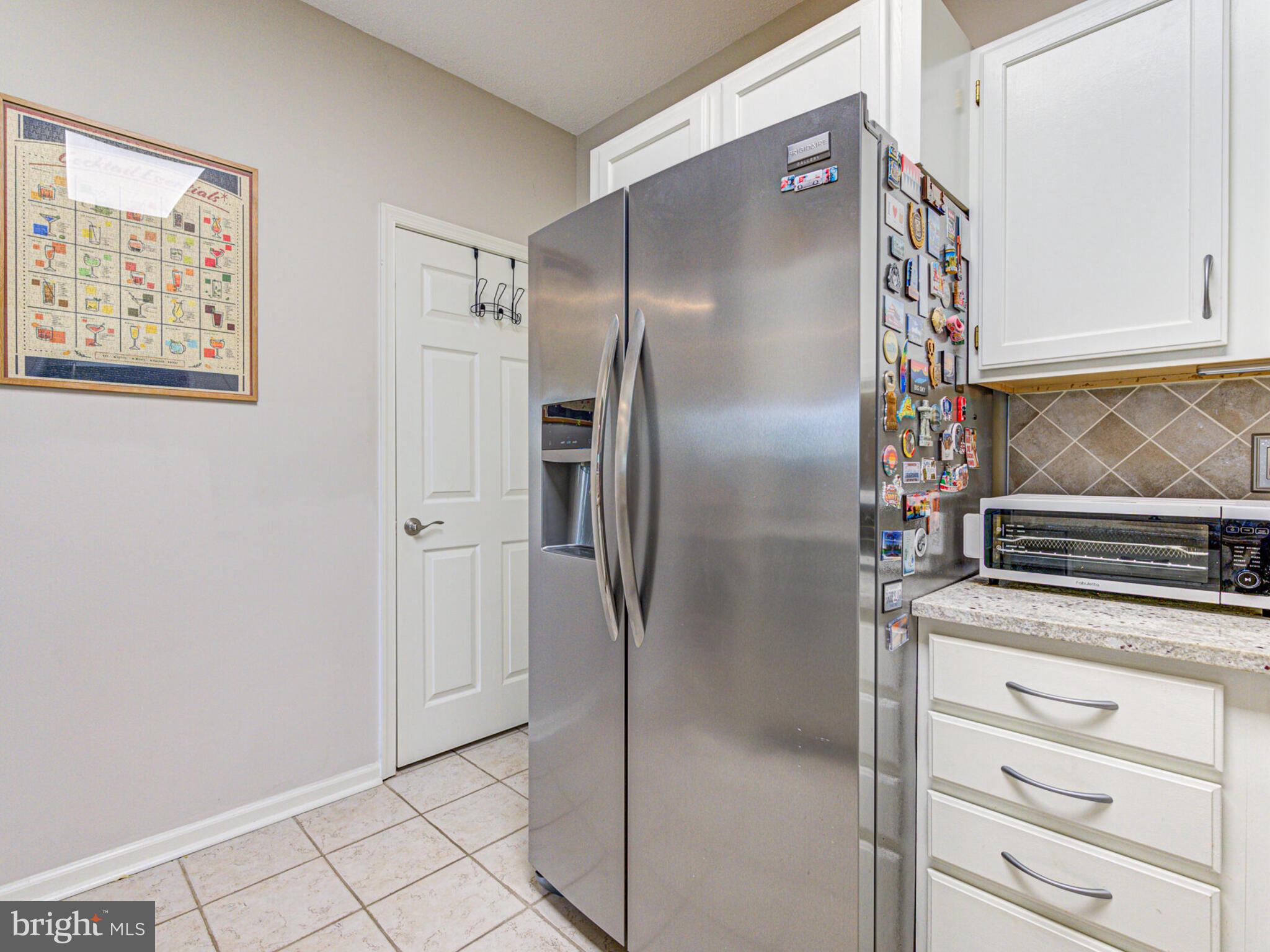 1720 Lake Shore Crest Drive, Unit 35 Reston, VA 20190 - Photo 21 of 41 a kitchen with stainless steel appliances granite countertop a refrigerator and a stove