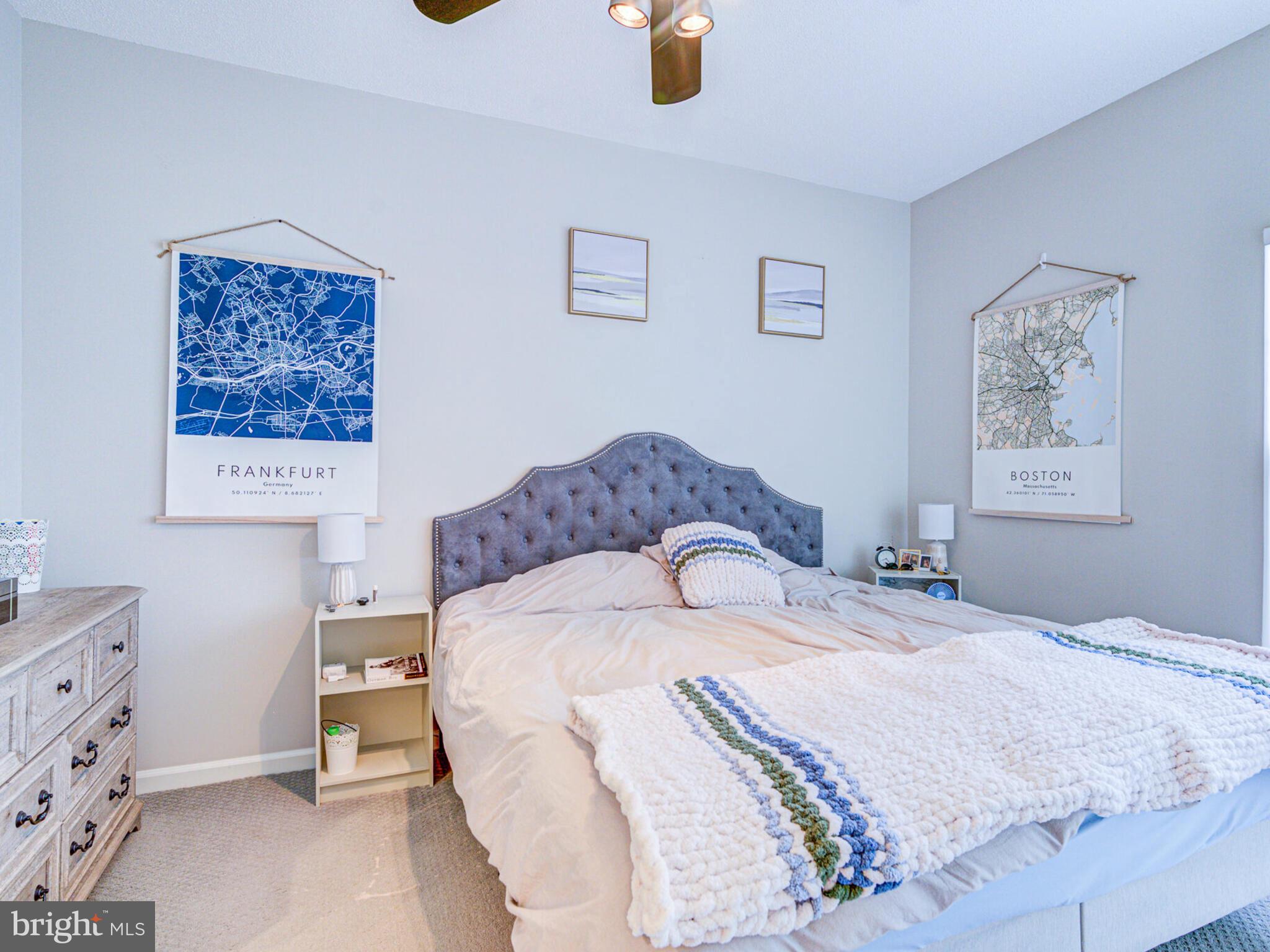 1720 Lake Shore Crest Drive, Unit 35 Reston, VA 20190 - Photo 23 of 41 a bedroom with a bed and a cabinets