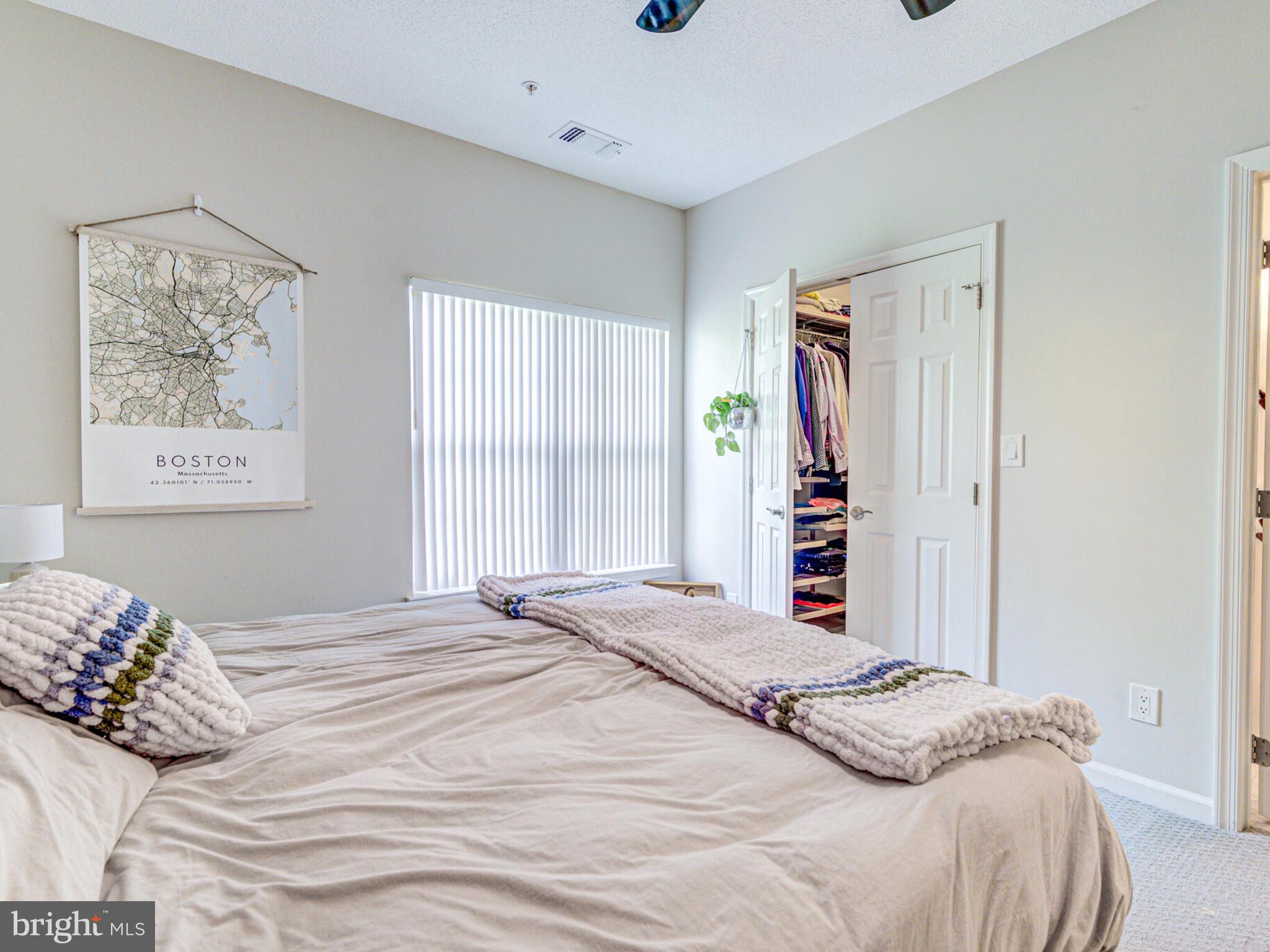 1720 Lake Shore Crest Drive, Unit 35 Reston, VA 20190 - Photo 25 of 41 a bedroom with a large bed and a window