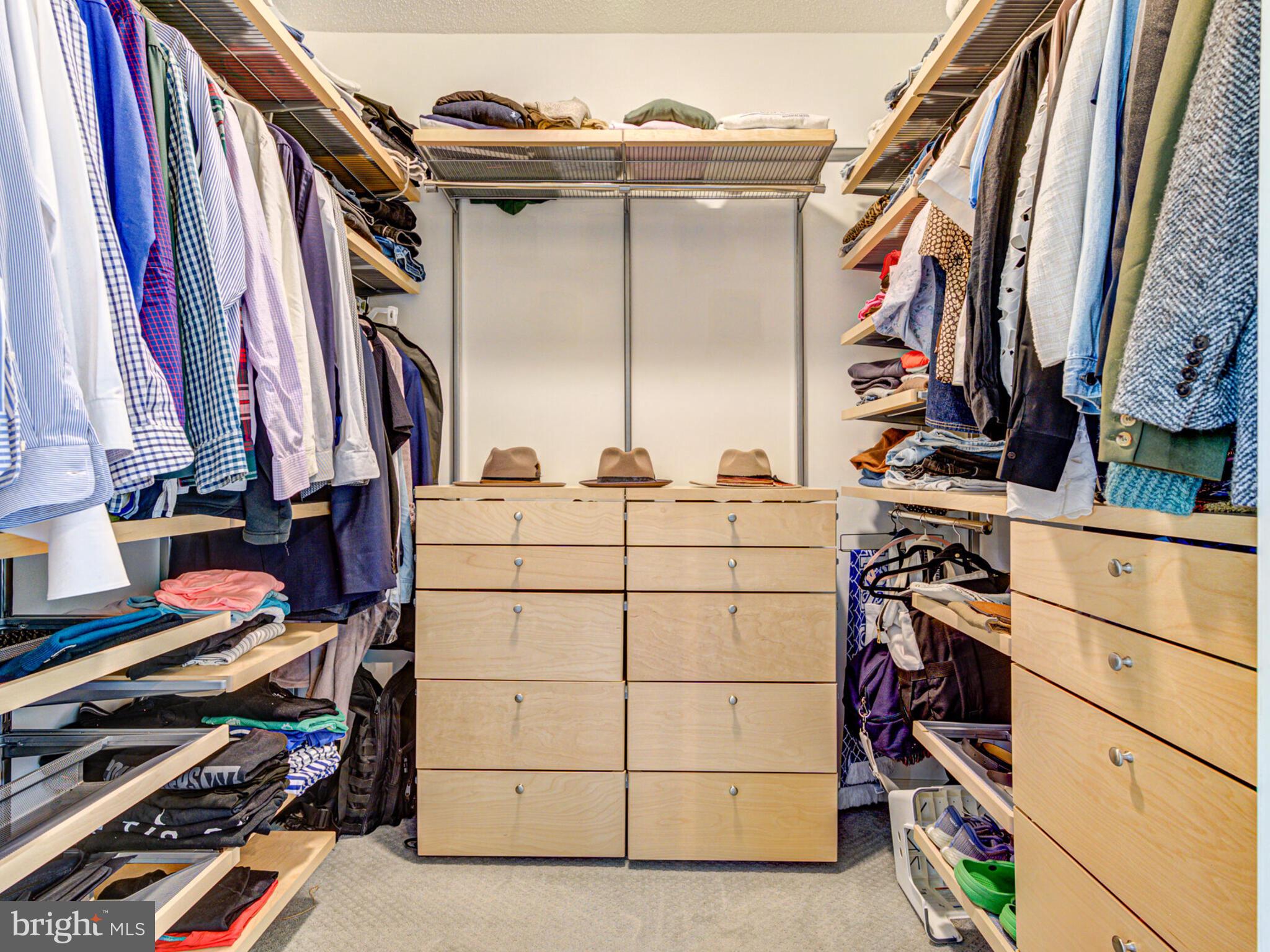 1720 Lake Shore Crest Drive, Unit 35 Reston, VA 20190 - Photo 26 of 41 a view of walk in closet with clothes and shoes