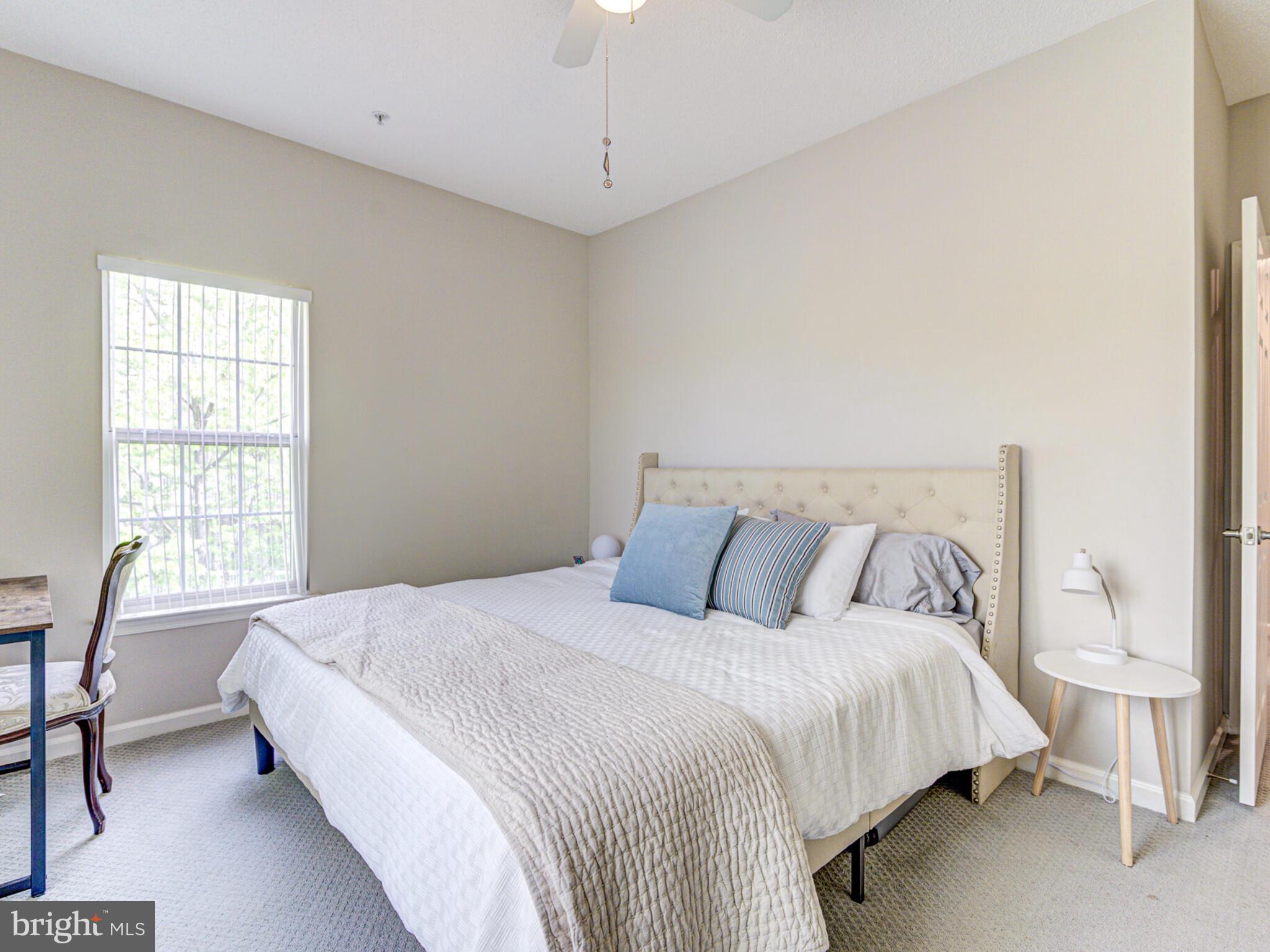 1720 Lake Shore Crest Drive, Unit 35 Reston, VA 20190 - Photo 30 of 41 a bed room with a bed and a chair