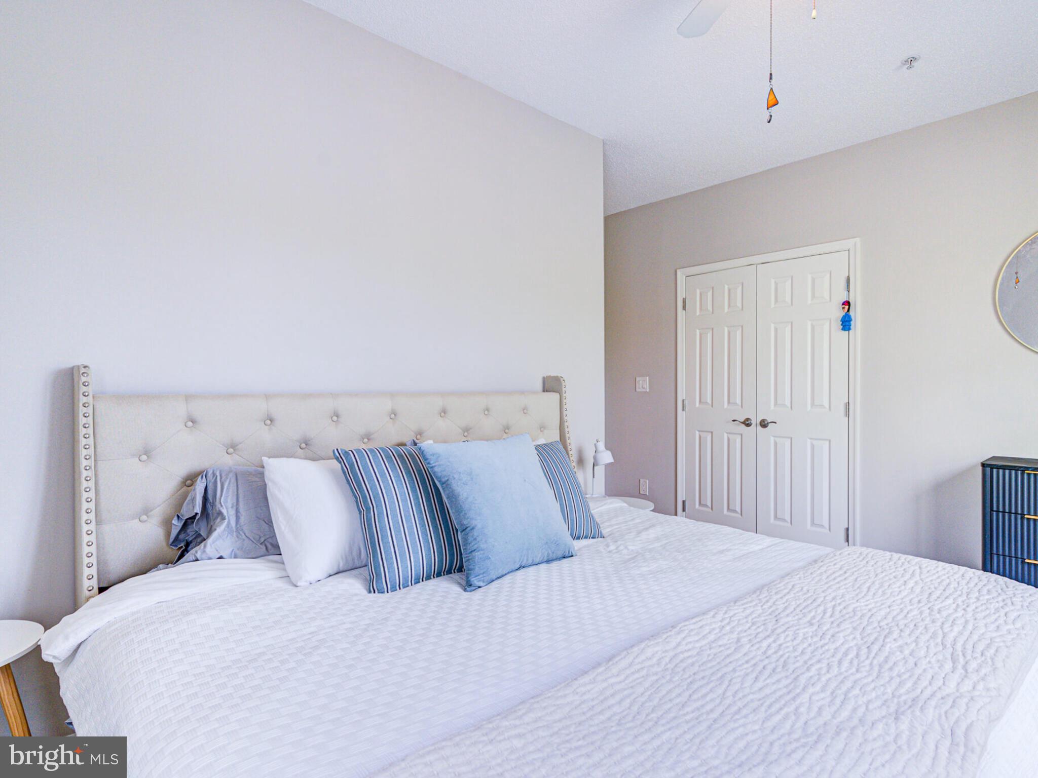 1720 Lake Shore Crest Drive, Unit 35 Reston, VA 20190 - Photo 32 of 41 a bedroom with a bed and a window