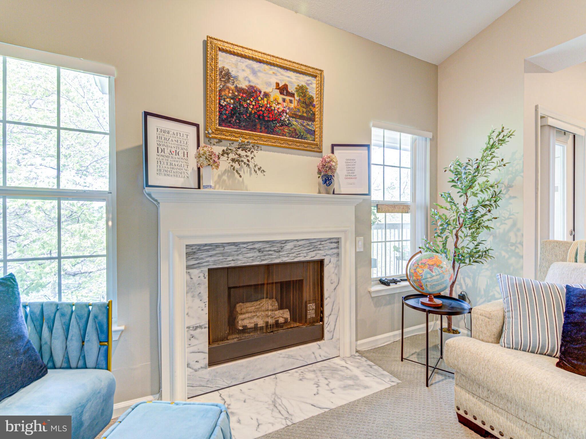 1720 Lake Shore Crest Drive, Unit 35 Reston, VA 20190 - Photo 8 of 41 a living room with furniture and a fireplace