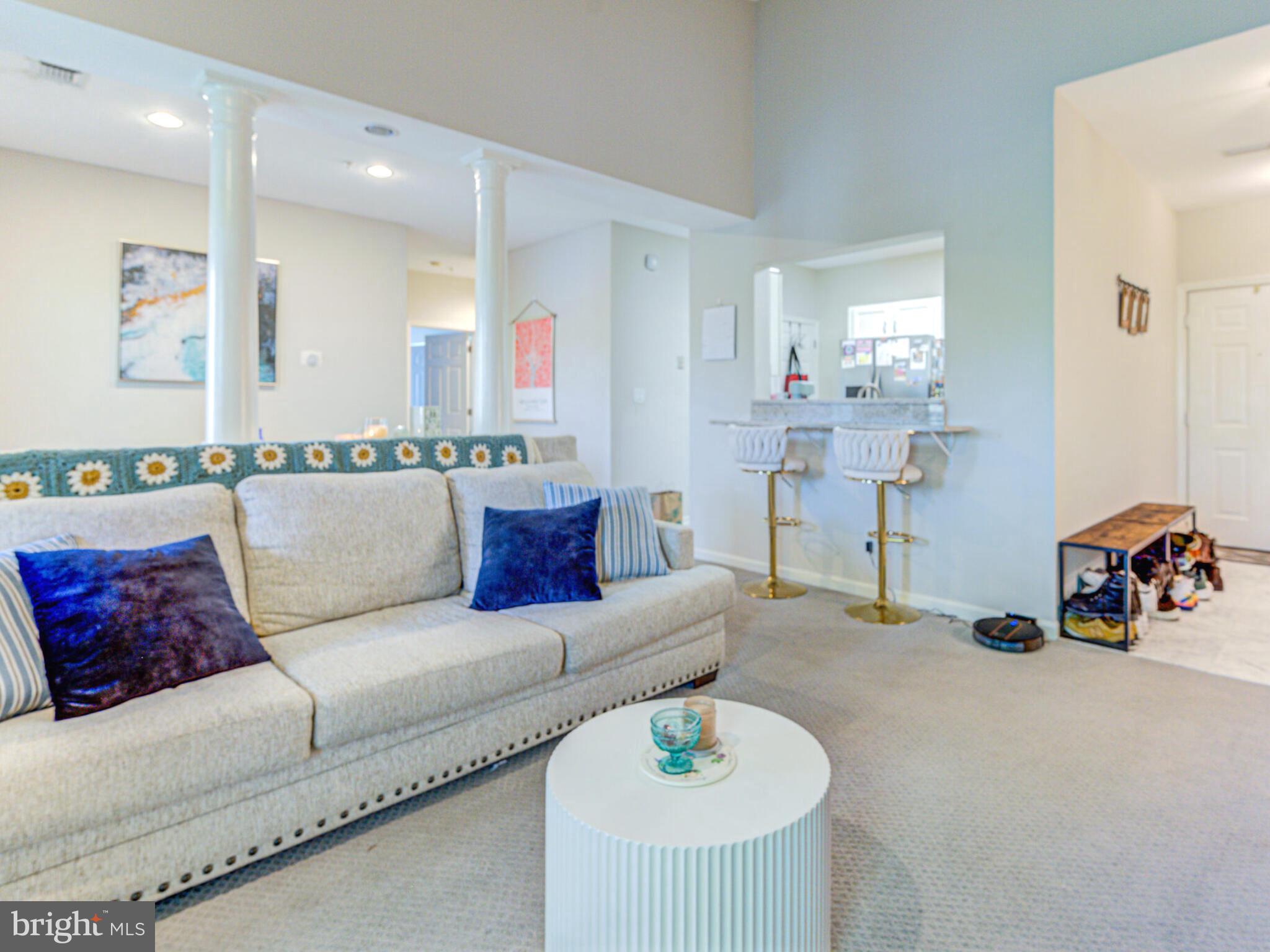1720 Lake Shore Crest Drive, Unit 35 Reston, VA 20190 - Photo 9 of 41 a living room with furniture and a table