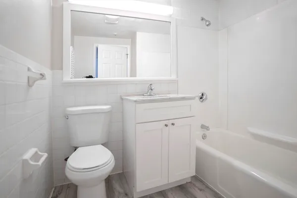 a bathroom with a sink toilet and bathtub