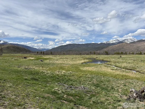 a view of a lake with a big yard