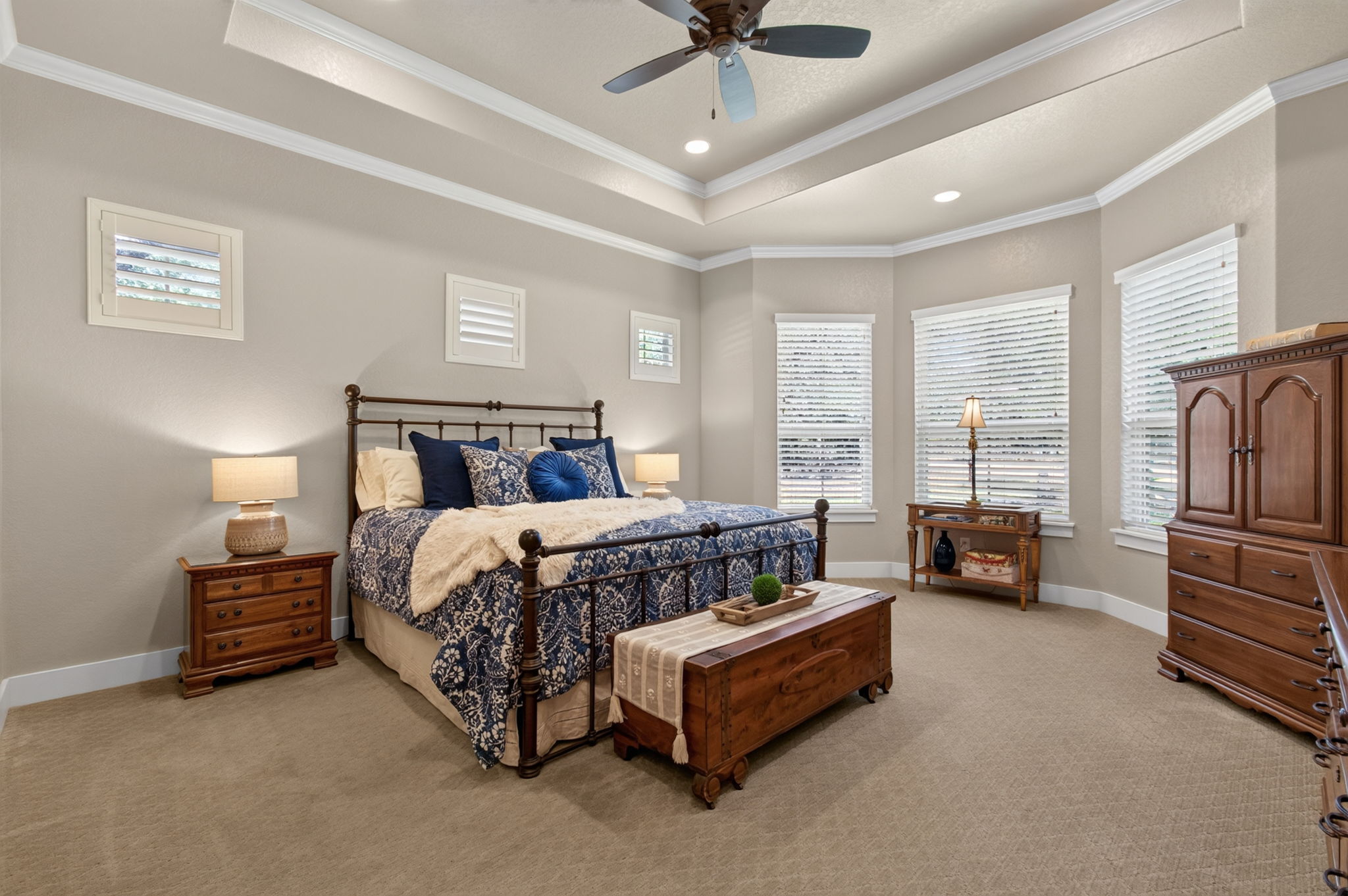 715 Long Ridge Spring Branch, TX 78070 - Photo 21 of 40 An elegant tray ceiling with crown molding highlights this spacious carpeted bedroom.