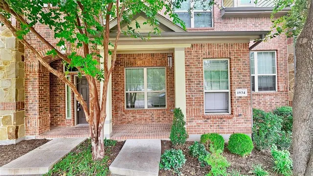 a front view of a house with a porch
