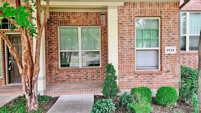 a brick house with a large windows