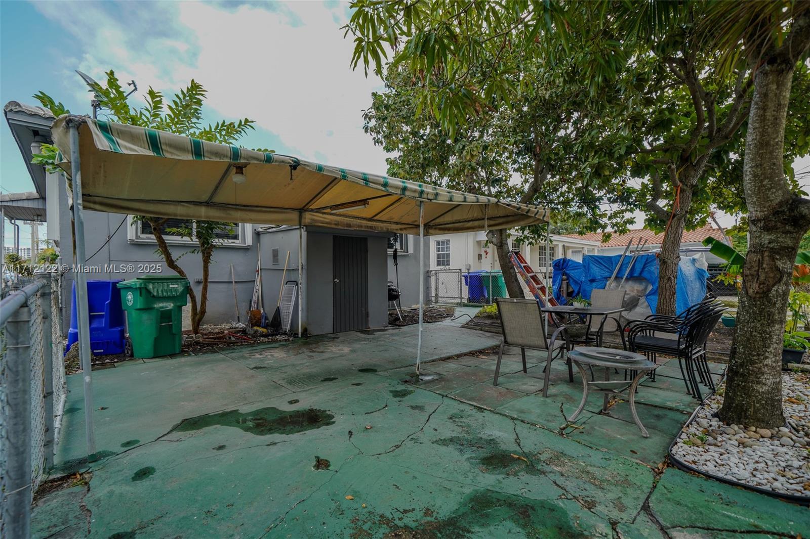 3140-42 Southwest 27th Terrace Miami, FL 33133 - Photo 3 of 3 a patio with table and chairs