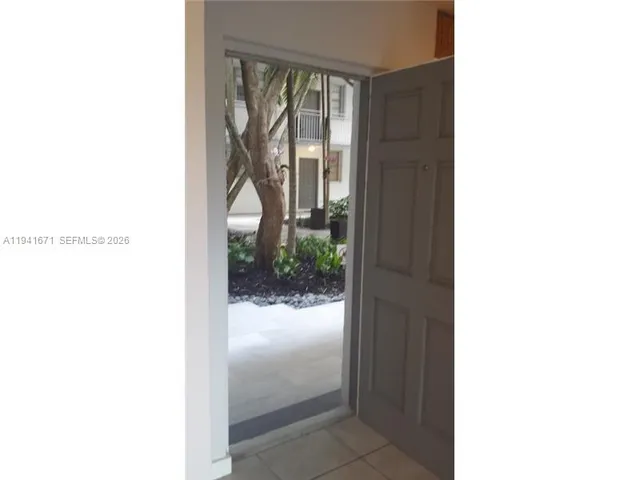 a view of a room with a floor to ceiling window