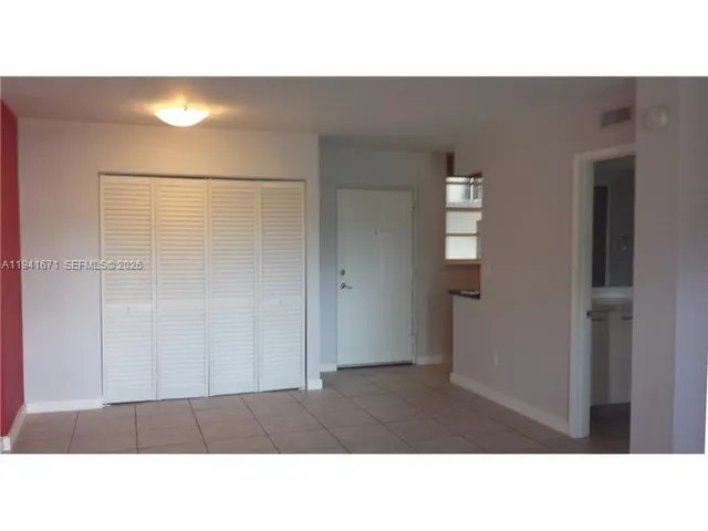a open living room with a wooden floor